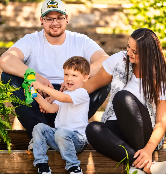 Cody Wellington smiling with his family